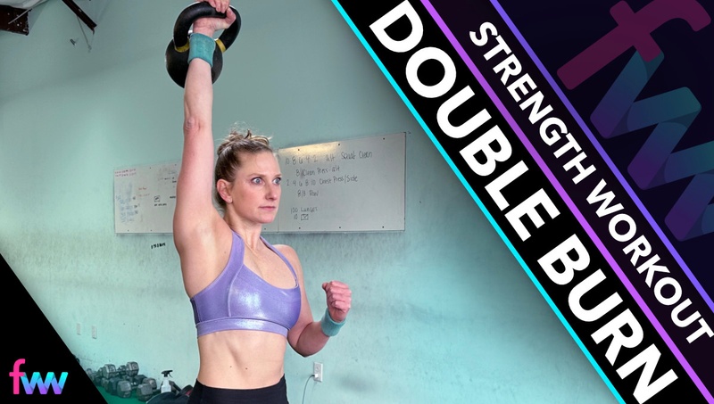 Kindal pressing the kettlebell over her head as she fully extends through her shoulder.