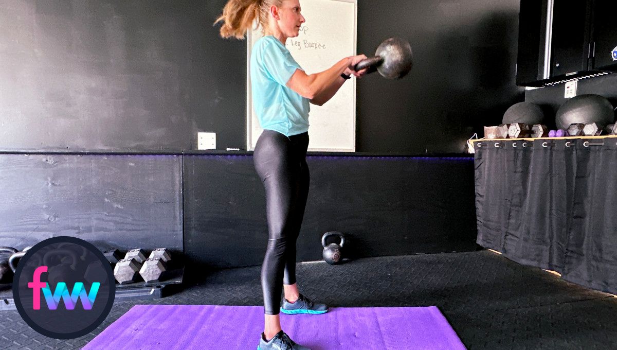 Kindal doing kettlebell swings and trying to improve her time on the workout