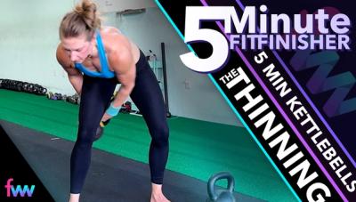 Kindal at the bottom of a kettlebell sling shot switching hands.