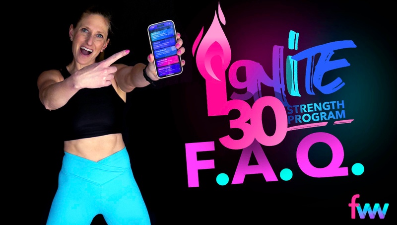 Kindal holding up her phone with the Ignite 30 app on it.