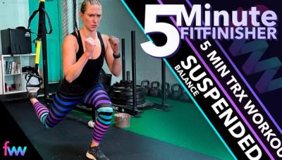 Kindal at the bottom of the TRX split squat fighting the muscle burn as she completes her last reps.