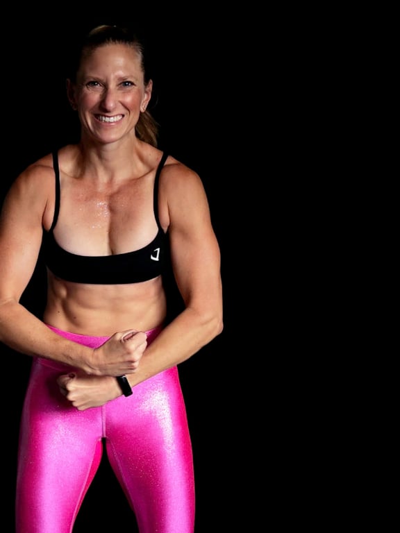 Kindal flexing ready to be your personal trainer